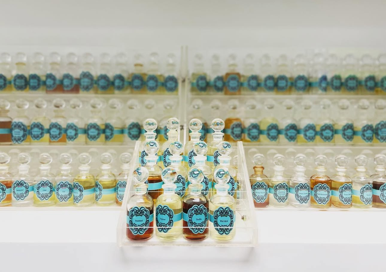Perfume, beautiful glass apothecary bottles with blue labels filled wit perfume ingredients