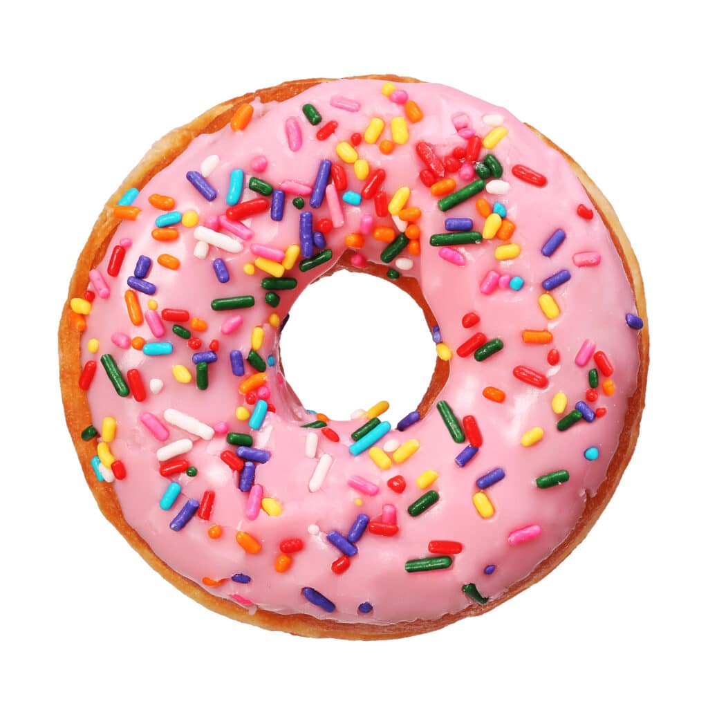 gourmand fragrance notes, donut with pink icing and colourful sprinkles on white isolated background